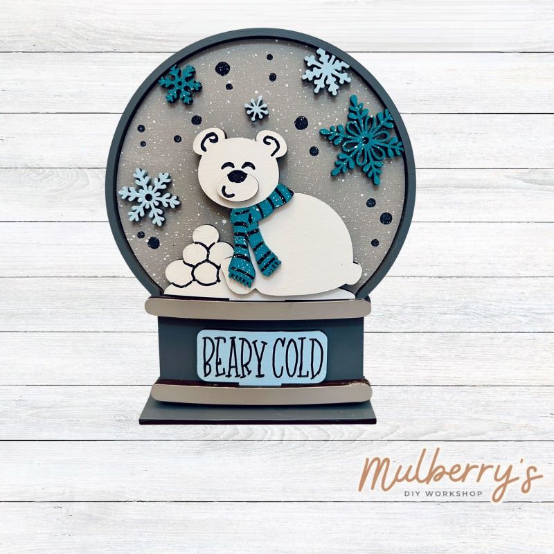 Our interchangeable mini snowglobe is the perfect addition to your seasonal decor! Simply switch out the interchangeable pieces for every holiday/season! Approximately 7" tall by 5.5" wide.