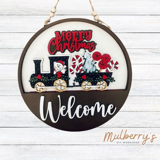 Welcome family and friends with our interchangeable welcome door hanger! Simply swap out inserts to match the different holidays and seasons! It's approximately 10.5" in diameter.  Includes: Welcome Door Hanger with Santa Train Insert. Additional inserts are available to purchase.