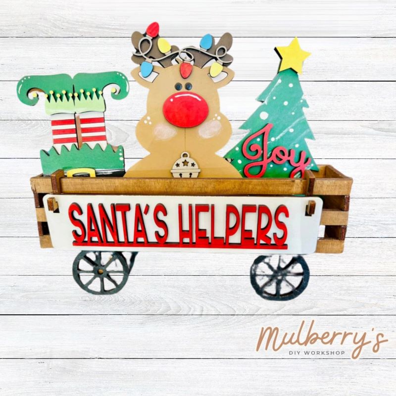 It doesn't get any cuter than our little rustic wagon! It's a perfect add on accessory to your décor. It's approximately 4" tall x 12" wide.  Includes: Wagon and Santa Inserts. Santa inserts include elf feet, reindeer, Christmas tree, and the Santa's Helpers banner.