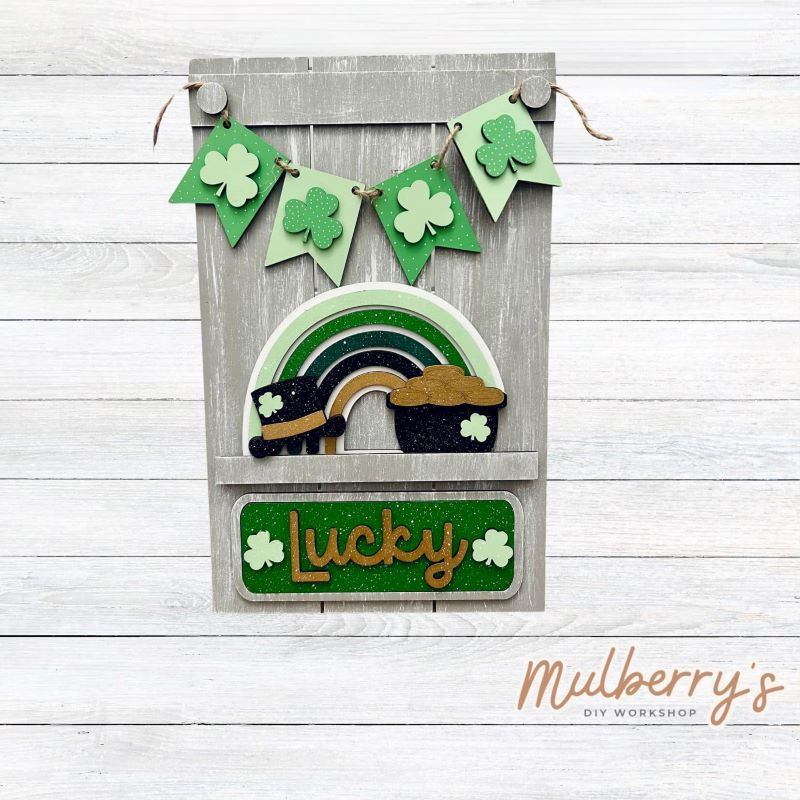 Our Interchangeable Pallet Stand measures roughly 15" tall by 9" wide.

This project can easily be changed out for holidays, seasons and other themes.

The set includes the pallet stand and St. Patty rainbow inserts.