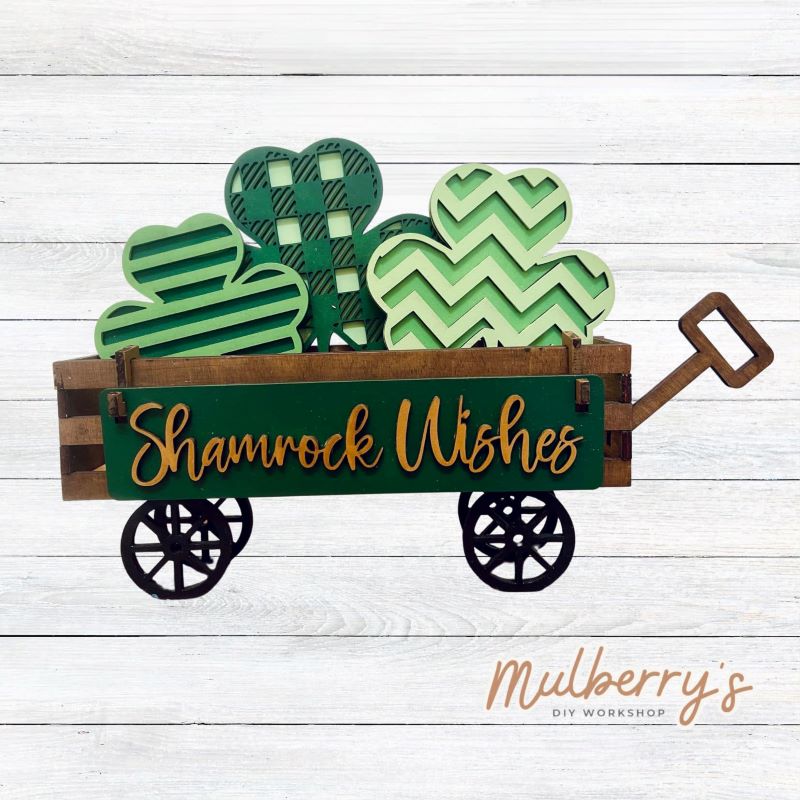 It doesn't get any cuter than our little rustic wagon!&nbsp; It's a perfect add on accessory to your décor. It's approximately 4" tall x 12" wide.  Includes: Wagon and St. Patty Inserts.  St. Patty inserts include three shamrocks and Shamrock Wishes banner.