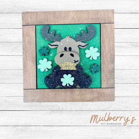 Our interchangeable square frame is the perfect way to display the different seasonal and holiday decorative tiles! Choose your favorite st. patty moose decorative tile to display inside! This listing includes the base and choice of one winter insert. Approximately 6" in diameter.