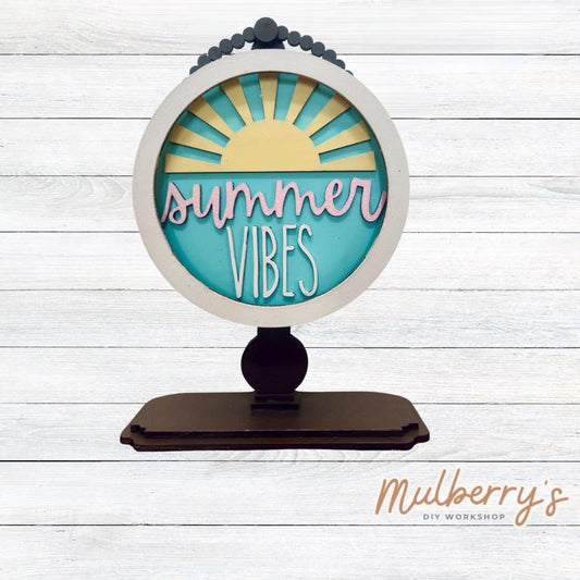 We love our interchangeable tabletop! It's approximately 10" tall and can display your favorite seasonal/holiday insert. This set includes the interchangeable tabletop and the summer vibes insert.