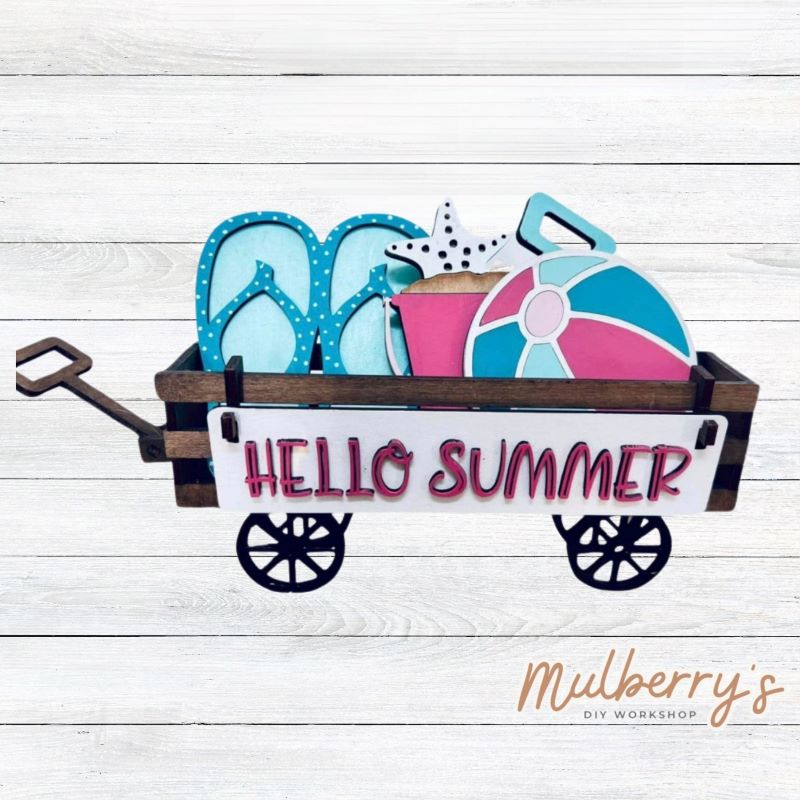 It doesn't get any cuter than our little rustic wagon! It's a perfect add on accessory to your décor. It's approximately 4" tall x 12" wide.  Includes: Wagon and Summer Inserts. Summer inserts include flip fllops, beach ball, sand bucket, and the Hello Summer banner.