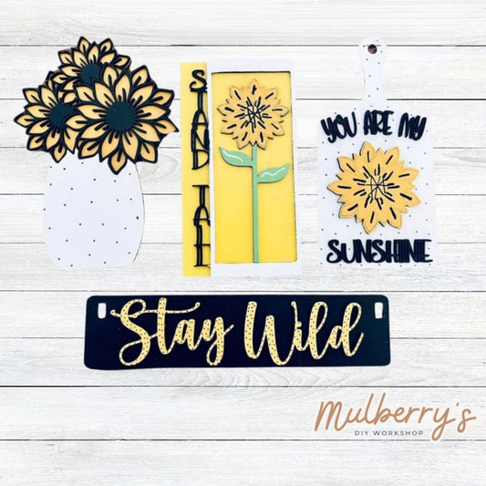 Our sunflower inserts are so versatile! Display them individually or in our interchangeable crate! Includes stand tall sign, sunflower vase, sunflower cutting board, and the Stay Wild banner.