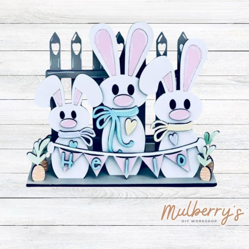 Our trio bunny shelf sitter is too cute! Approximately 8" tall by 9" wide.