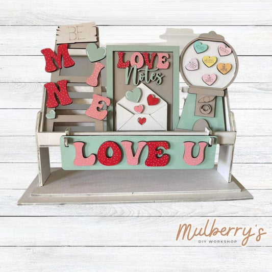 It doesn't get any cuter than our little rustic crate! It's a perfect add on accessory to your décor. It's approximately 13" long. Includes: Crate and Valentine Gumball Inserts. Valentine Gumball inserts include Be Mine Ladder, Love Notes, Gumball, and Love U Banner.