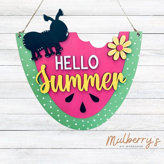 Our hello summer watermelon mini door hanger is super sweet! Approximately 10" tall by 9" wide.