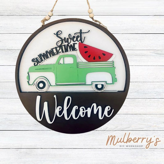 Welcome family and friends with our interchangeable welcome door hanger! Simply swap out inserts to match the different holidays and seasons! It's approximately 10.5" in diameter.  Includes: Welcome Door Hanger with Watermelon Sweet Summertime Insert. Additional inserts are available to purchase.