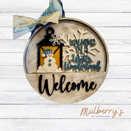 Welcome family and friends with our interchangeable welcome door hanger! Simply swap out inserts to match the different holidays and seasons! It's approximately 10.5" in diameter.