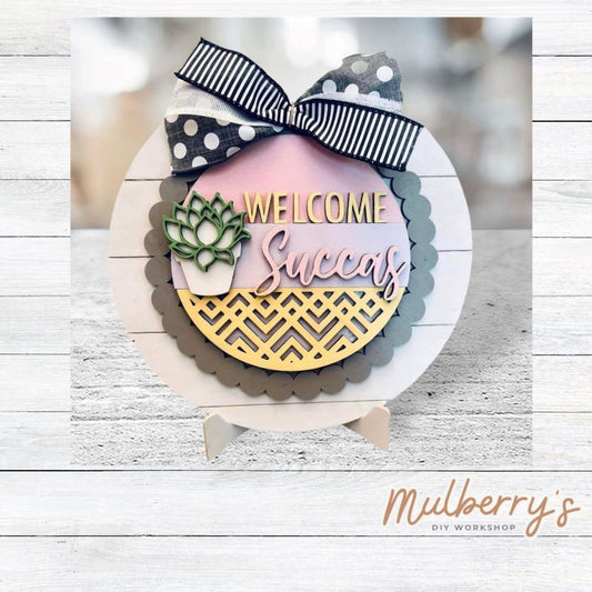 We love our large interchangeable plate with stand! It's approximately 11.5-inches is diameter and can display your favorite seasonal/holiday insert. This set includes the large interchangeable plate with stand and the welcome succas insert.