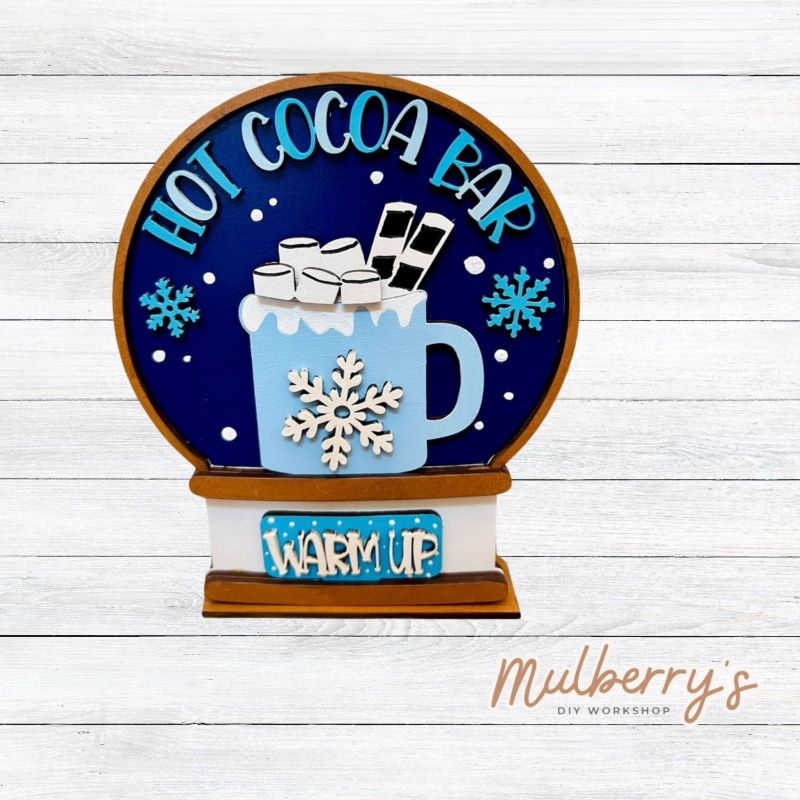 Our interchangeable mini snowglobe is the perfect addition to your seasonal decor! Simply switch out the interchangeable pieces for every holiday/season! Approximately 7" tall by 5.5" wide.