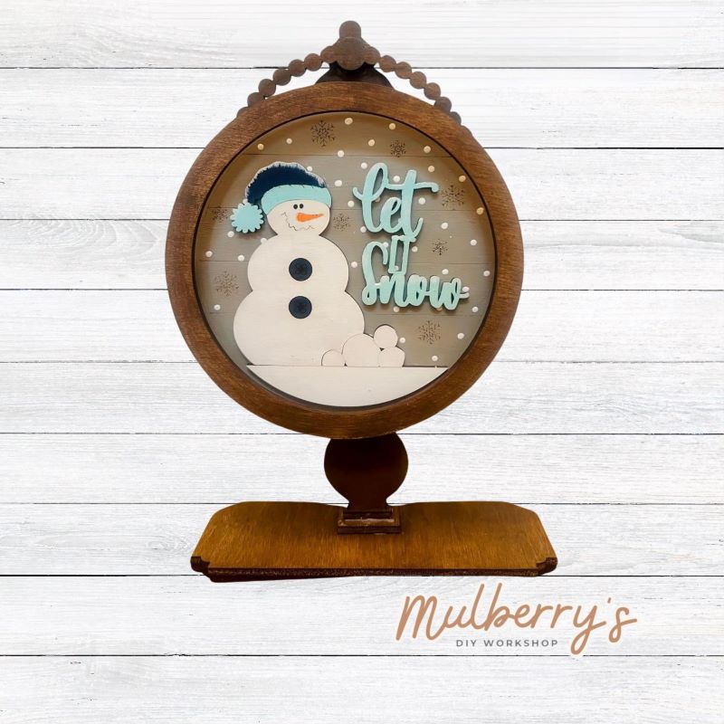 We love our interchangeable tabletop! It's approximately 10" tall and can display your favorite seasonal/holiday insert. This set includes the interchangeable tabletop and the let it snow insert.