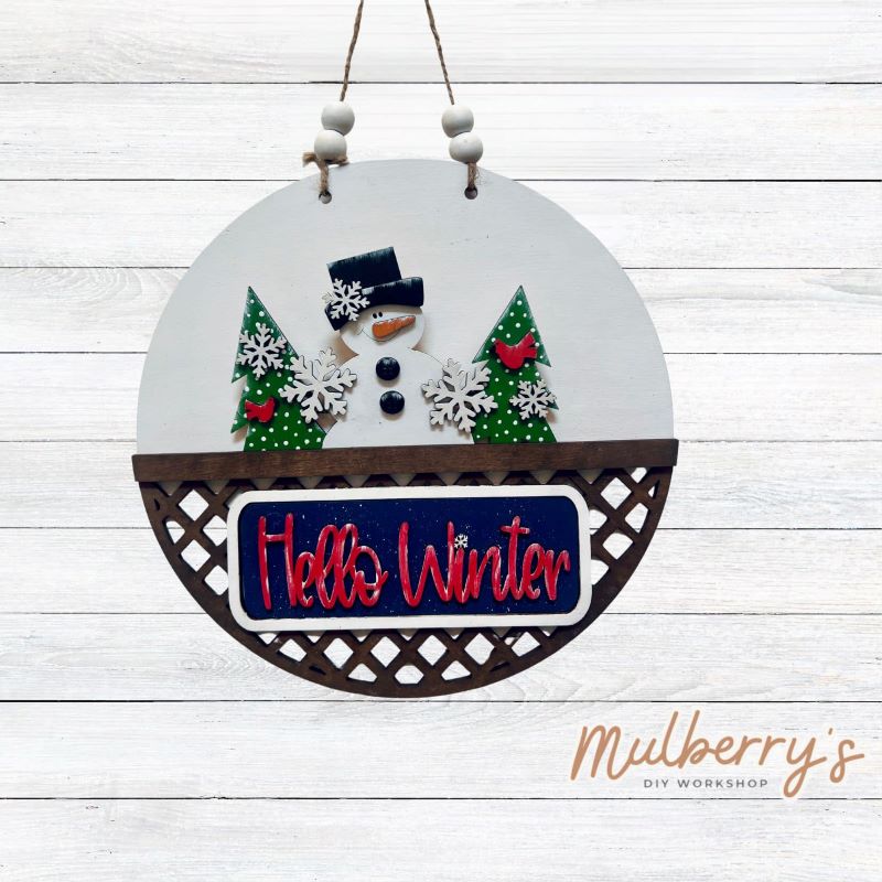 Welcome family and friends with our interchangeable lattice round door hanger! Simply swap out inserts to match the different holidays and seasons! It's approximately 10.5" in diameter.  Includes: Lattice Round Door Hanger with Winter Inserts. Additional inserts are available to purchase.