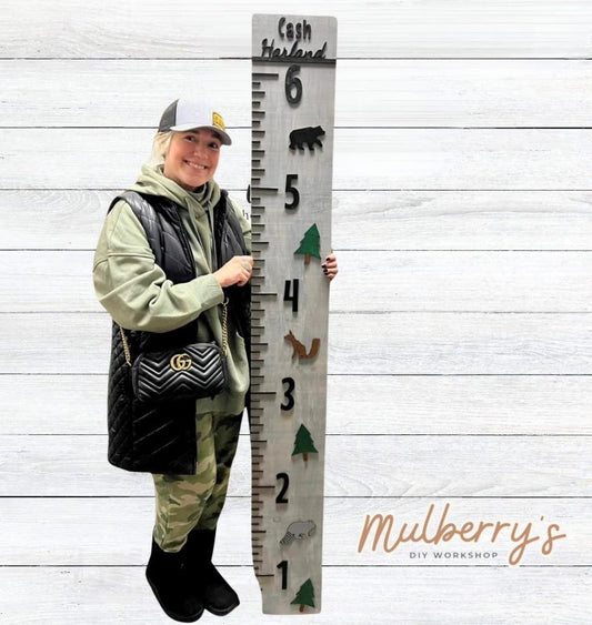 Our 6-foot persoanlized growth chart makes a huge statement. The woodland theme displays trees, a bear, a squirrel, and a raccoon. It can be personalized with a name.